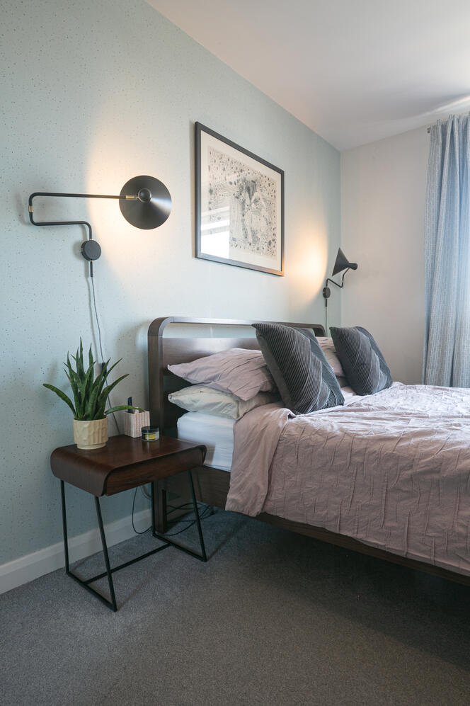 Walnut effect furnishing throughout the bedroom